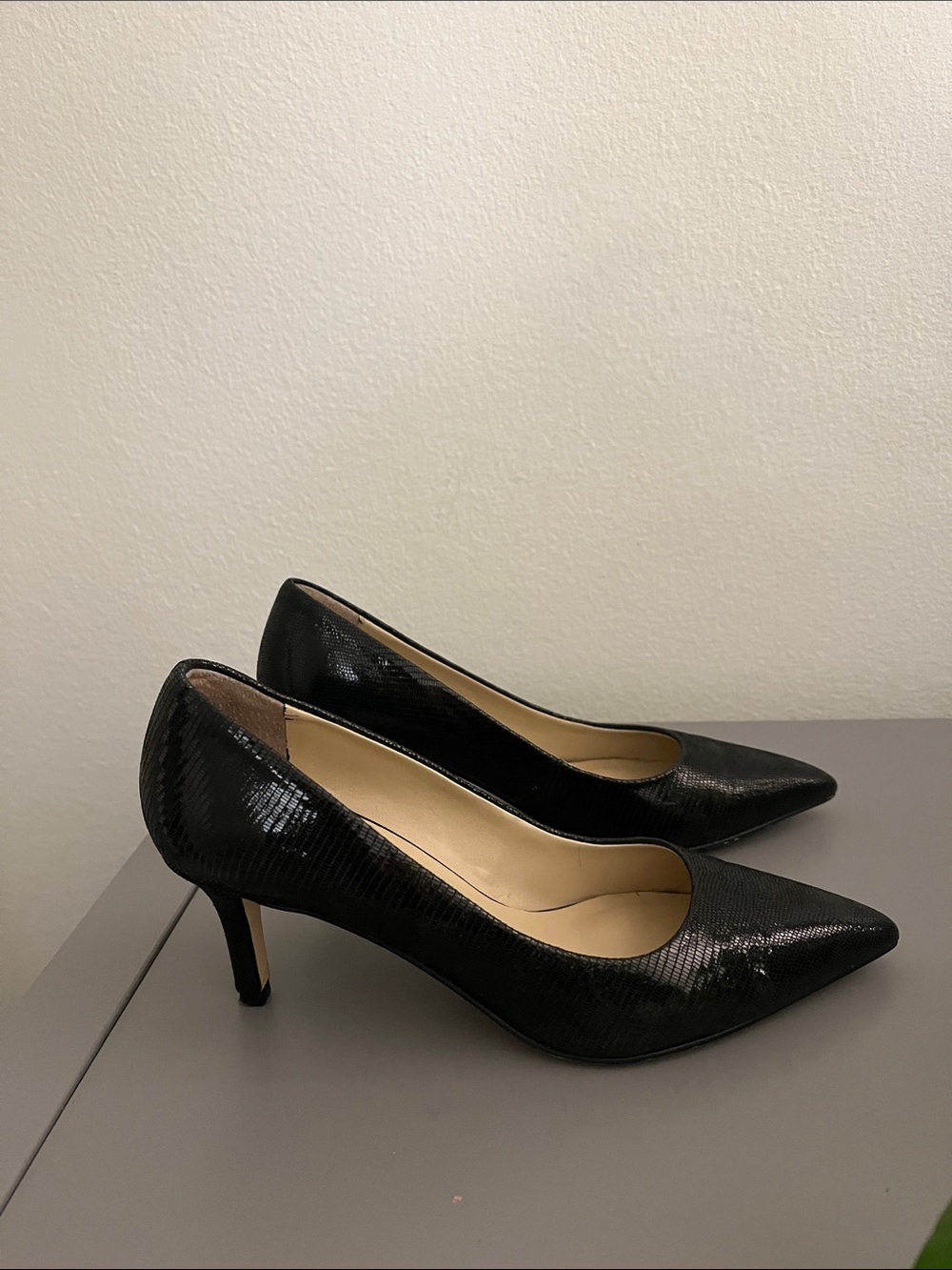 Textured Pointed-Toe Pumps in black.